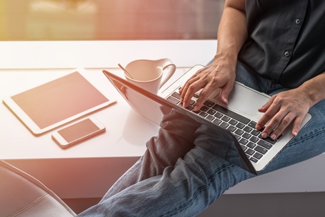 Person typing on computer